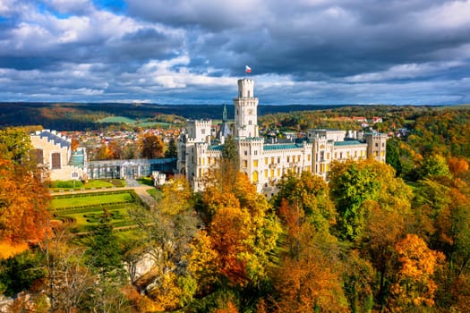 Castle Hluboka nad Vltavou is one of the most beautiful castles in Czech Republic. Castle Hluboka nad Vltavou in autumn with red foliage, Czechia. Colorful autumn view of Hluboka nad Vltavou castle.