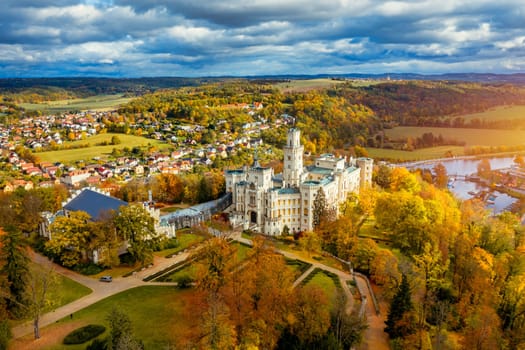 Castle Hluboka nad Vltavou is one of the most beautiful castles in Czech Republic. Castle Hluboka nad Vltavou in autumn with red foliage, Czechia. Colorful autumn view of Hluboka nad Vltavou castle.