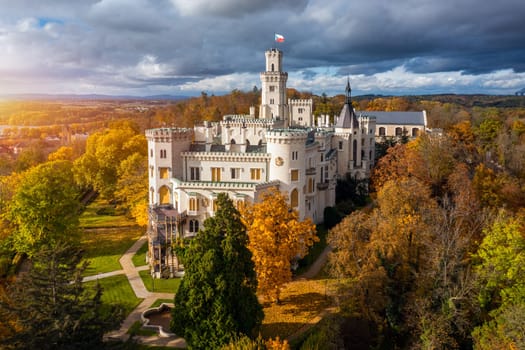 Castle Hluboka nad Vltavou is one of the most beautiful castles in Czech Republic. Castle Hluboka nad Vltavou in autumn with red foliage, Czechia. Colorful autumn view of Hluboka nad Vltavou castle.