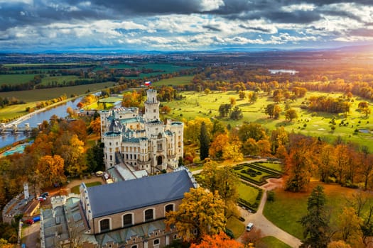 Castle Hluboka nad Vltavou is one of the most beautiful castles in Czech Republic. Castle Hluboka nad Vltavou in autumn with red foliage, Czechia. Colorful autumn view of Hluboka nad Vltavou castle.