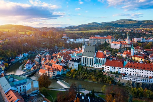 Aerial view of historical centre of Cesky Krumlov town on Vltava riverbank on autumn day overlooking medieval Castle, Czech Republic. View of old town of Cesky Krumlov, South Bohemia, Czech Republic.