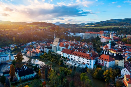 Aerial view of historical centre of Cesky Krumlov town on Vltava riverbank on autumn day overlooking medieval Castle, Czech Republic. View of old town of Cesky Krumlov, South Bohemia, Czech Republic.