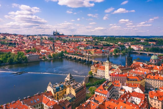 Prague scenic spring aerial view of the Prague Old Town pier architecture Charles Bridge over Vltava river in Prague, Czechia. Old Town of Prague with the Castle in the background, Czech Republic.