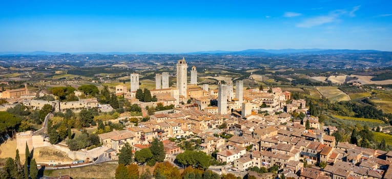 Town of San Gimignano, Tuscany, Italy with its famous medieval towers. Aerial view of the medieval village of San Gimignano, a Unesco World Heritage Site. Italy, Tuscany, Val d'Elsa.