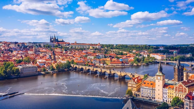Prague scenic spring aerial view of the Prague Old Town pier architecture Charles Bridge over Vltava river in Prague, Czechia. Old Town of Prague with the Castle in the background, Czech Republic.