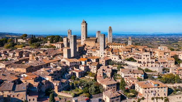 Town of San Gimignano, Tuscany, Italy with its famous medieval towers. Aerial view of the medieval village of San Gimignano, a Unesco World Heritage Site. Italy, Tuscany, Val d'Elsa.