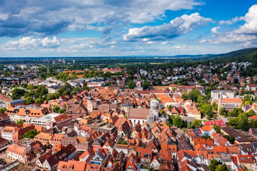 Old city of Ettlingen in Germany with a river and a church. View of a central district of Ettlingen, Germany, with a river and a bell tower of a church. Ettlingen, Baden Wurttemberg, Germany.