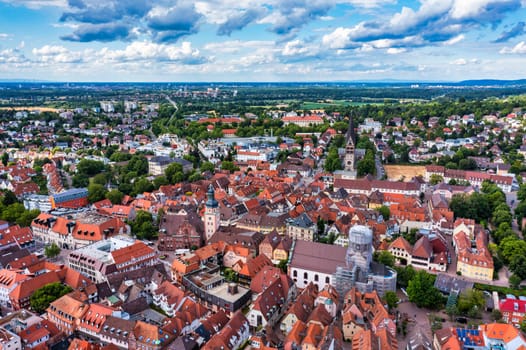 Old city of Ettlingen in Germany with a river and a church. View of a central district of Ettlingen, Germany, with a river and a bell tower of a church. Ettlingen, Baden Wurttemberg, Germany.