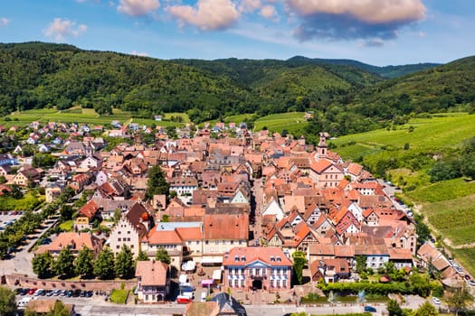 View of Riquewihr village and vineyards on Alsatian Wine Route, France. Most beautiful villages of France, Riquewihr in Alsace, famous "vine rote". Colorful town of Riquewihr, Alsace, France.