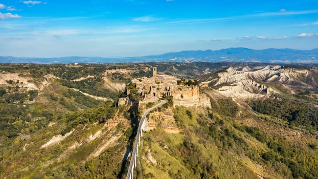 The famous Civita di Bagnoregio on a sunny day. Province of Viterbo, Lazio, Italy. Medieval town on the mountain, Civita di Bagnoregio, popular touristic stop at Tuscany, Italy.