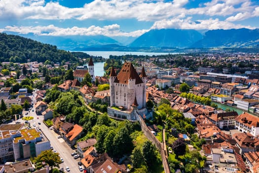 Panorama of Thun city with Alps and Thunersee lake, Switzerland. Historical Thun city and lake Thun with Bernese Highlands swiss Alps mountains in background, Canton Bern, Switzerland.