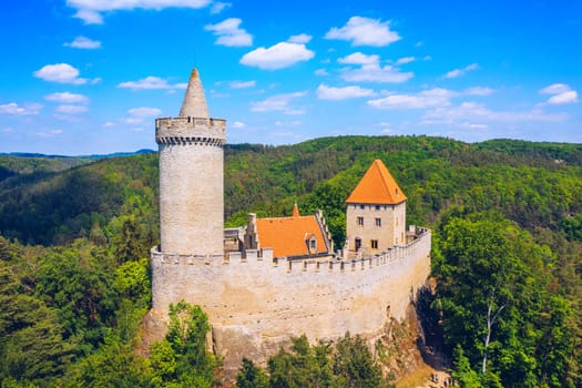 Aerial view of medieval castle Kokorin nearby Prague in Czechia. Central Europe. Medieval gothic castle Kokorin, Kokorinsko protected landscape area in Czech Republic. Medieval gothic castle Kokorin.
