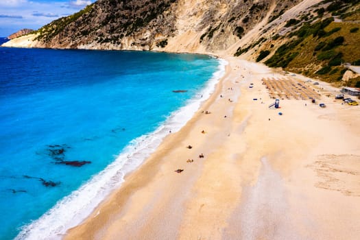Aerial drone view of iconic turquoise and sapphire bay and beach of Myrtos, Kefalonia (Cephalonia) island, Ionian, Greece. Myrtos beach, Kefalonia island, Greece. Beautiful view of Myrtos beach.