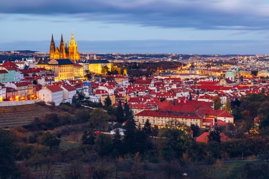 Prague autumn landscape. Prague autumn landscape view to Saint Vitus cathedral. Prague. Prague panorama. Prague, Czech Republic. Scenic autumn aerial view of the Old Town with red foliage. Czechia.