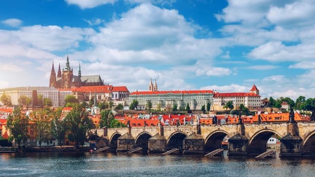 Prague scenic spring view of the Prague Old Town pier architecture Charles Bridge over Vltava river in Prague, Czechia. Old Town of Prague with the Castle in the background, Czech Republic.