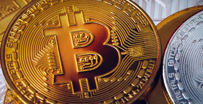 Stack of cryptocurrencies with a golden bitcoin. Bitcoin as most important cryptocurrency concept. Bitcoin. Physical bit coin. Digital currency. Cryptocurrency. Golden coin with bitcoin