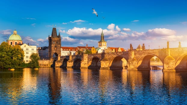 Old town of Prague. Czech Republic over river Vltava with Charles Bridge on skyline. Prague panorama landscape view with red roofs.  Prague view from Petrin Hill, Prague, Czechia.