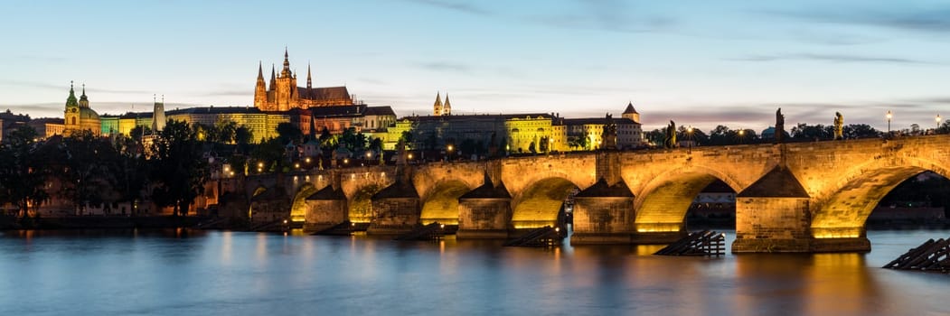 Charles Bridge in Prague in Czechia. Prague, Czech Republic. Charles Bridge (Karluv Most) and Old Town Tower. Vltava River and Charles Bridge. Concept of world travel, sightseeing and tourism.