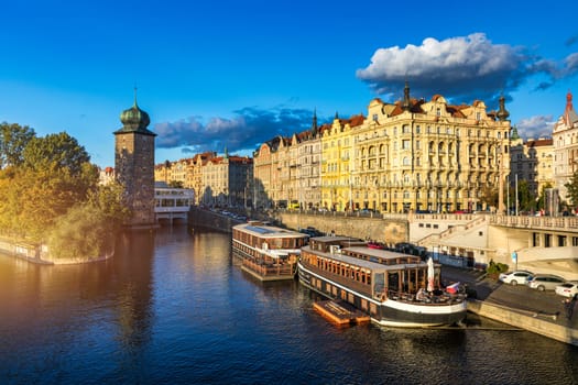Scenic embankment in Prague city; Historical center of Prague, buildings and landmarks of old town, Prague, Czech Republic. Embankment of the Vltava river in Prague, the capital of Czechia.