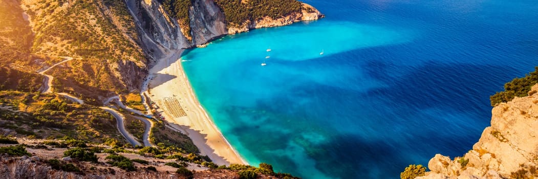 Aerial drone view of iconic turquoise and sapphire bay and beach of Myrtos, Kefalonia (Cephalonia) island, Ionian, Greece. Myrtos beach, Kefalonia island, Greece. Beautiful view of Myrtos beach.