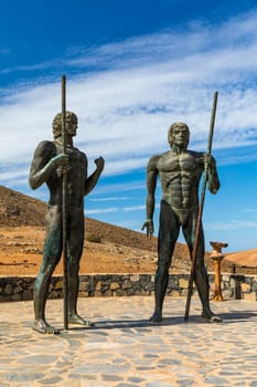 Two giant statues of the ancient kings of Fuerteventura installed on the Giza viewpoint, Betancuria, Fuerteventura, Spain