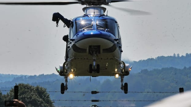 Capturing the active duty of a police helicopter patrol against a serene sky, symbolizing vigilance.