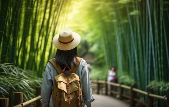 Eco travel and responsible tourism. Asian woman walking at Bamboo Forest, rear view. AI Generated