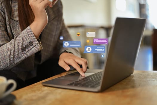 Businessman using laptop with notification icons of message. Technology and communication concept.