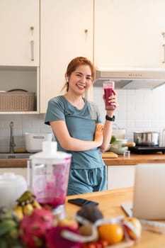 Portrait of beauty body slim healthy asian woman drinking glass of juice. young woman prepare cooking healthy drink in kitchen at home. Diet concept. healthy drink.