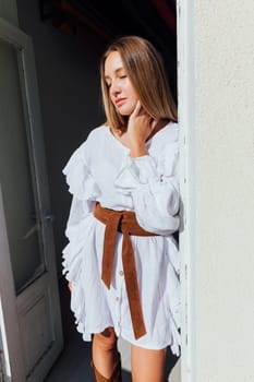 fashionable woman in white vintage western dress
