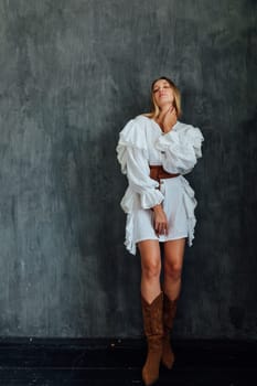 fashionable woman in white vintage western dress