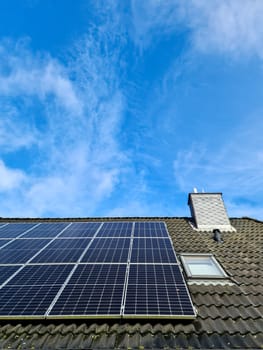 Solar panels producing clean energy on a roof of a residential house