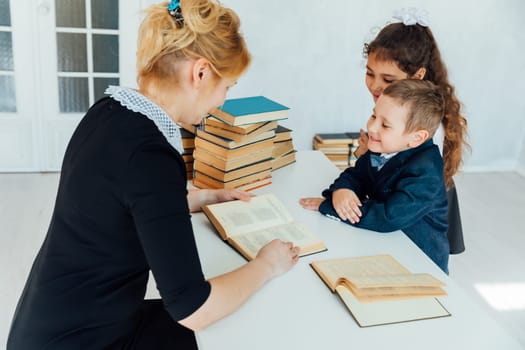 Children answer a question to a teacher school