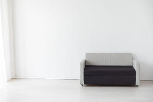 sofa in a bright room against a wall