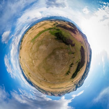 Little planet transformation of spherical panorama 360 degrees of beauty day in the mountains in Altay. Aerial shot on drone. Virtual reality content