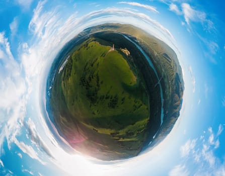 Little planet transformation of spherical panorama 360 degrees of beauty day in the mountains in Altay. Aerial shot on drone. Virtual reality content. The famous tourist place called the Devil's Finger on the border of the Altai Republic and the Altai