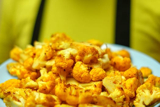 Steak of baked cauliflower with herbs. Healthy eating. Selective focus