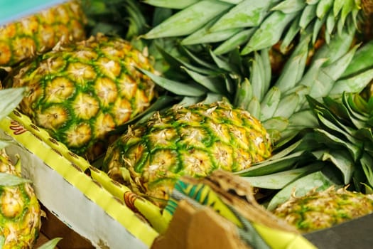 Pineapple fruit on the shelves of a grocery hypermarket. Selective focus. Buying fruit