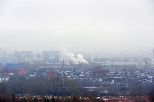 A view of a city in the fog. Selective focus. Birds eye view. Selective focus