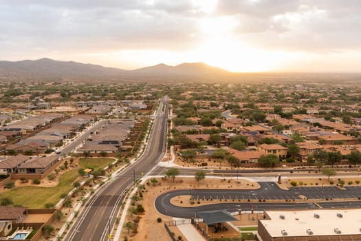 Aerial View Landscape Of Road And Mountain Buttes, Residential Area In Phoenix, Arizona On Orange Sunrise Or Sunset Sky. Arizona. National Arizona Day, June 21 Beautiful Hills, Scenic Landscape