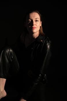 Woman in black clothes in a room