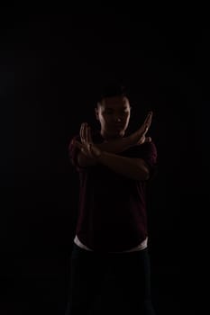 A man dancing in the dark in a studio music