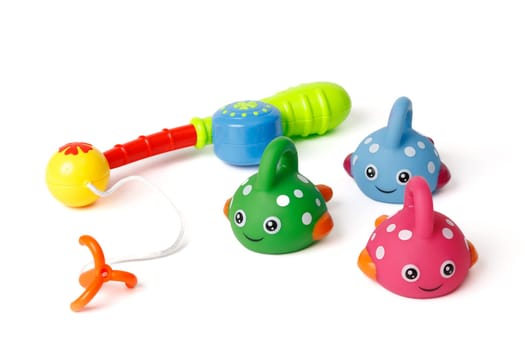 Children's set of funny colorful fish and a fishing rod, for the development of motor skills in children.