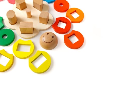 Wooden puzzle toy that develops logic and fine motor skills for preschool age kids, copy space.