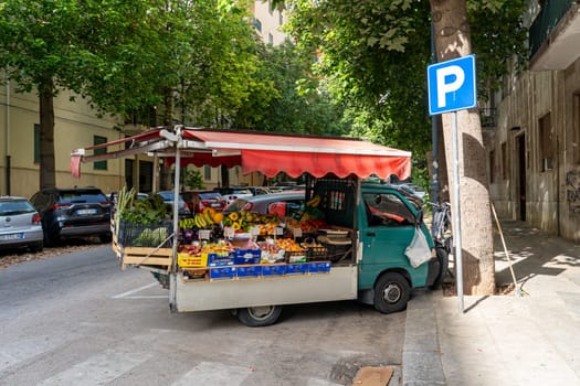 Palermo, Italy - July 20, 2023: A fruit selling truck in the streets of the historic city center.