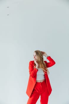 Beautiful blonde woman in red business suit