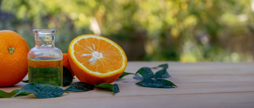 Essential extract of orange oil in a small bottle.