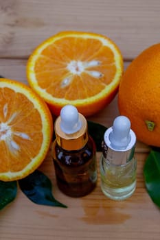 Essential extract of orange oil in a small bottle.