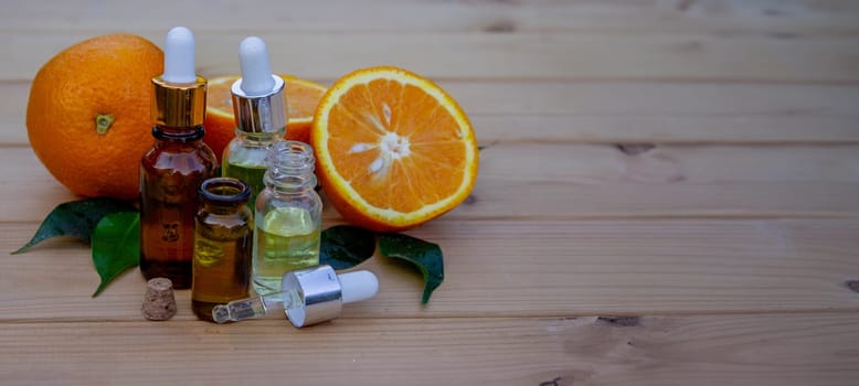 Essential extract of orange oil in a small bottle.