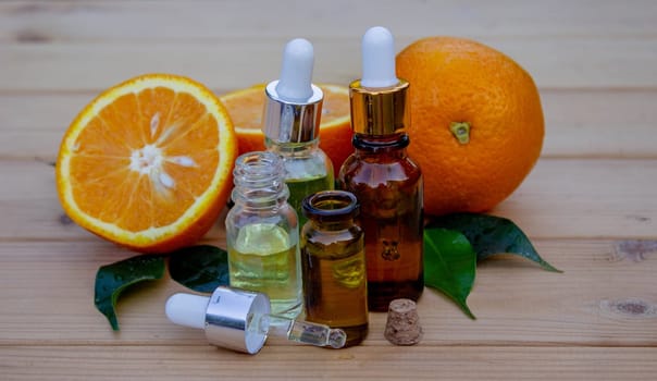 Essential extract of orange oil in a small bottle.